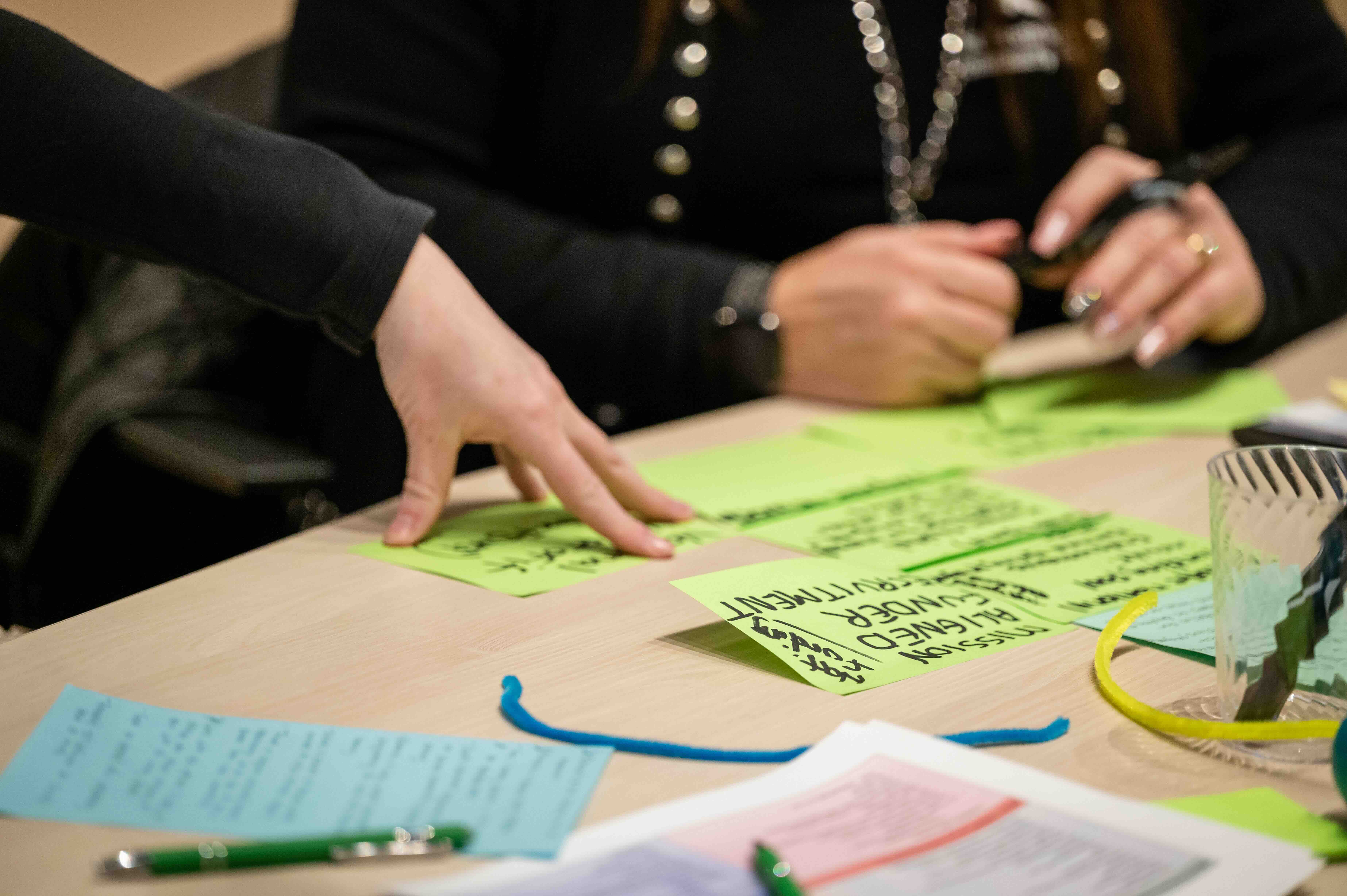 Strategic planning session, looking at notecards
